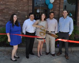 Dr. Paula Santos cut the ribbon to celebrate Assessment, Consultation and Treatment joining the Pasadena Chamber.