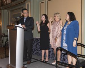 Chair Justin Tsui swears in new and returning Board members Hope Hayman, Debbie Unruh and Elizabeth Dever Justin Tsui swears in new Board members