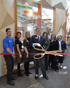 Kidspace Executive Director Michael Shanklin cut the ribbon to open the Imagination Workshop.