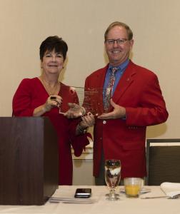 Chamber Board Chair Robin McCarthy presents a plaque to Lance Tibbet. Robin McCarthy ;presentation to Lance Tibbet