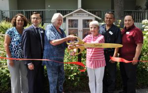 Villa Gardens unveiled their Little Free Library with a ribbon cutting.